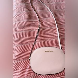 Michael Kors blush pink crossbody purse.